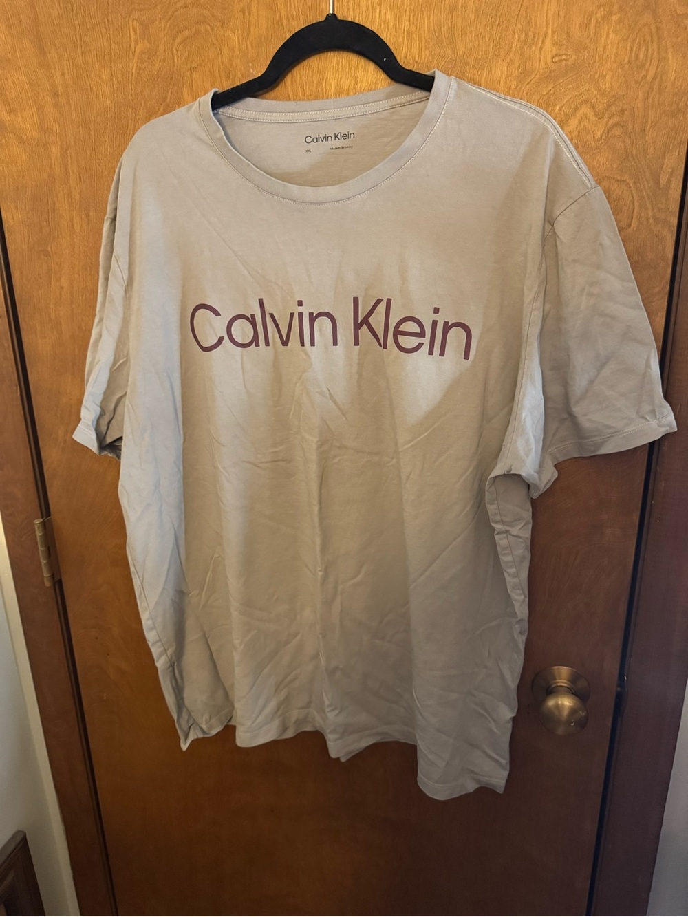 Calvin Klein Light Beige Crewneck Tee with maroon Logo